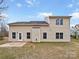 Rear view of house showcasing additional windows and patio at 2154 Pheasant Glen Rd, Charlotte, NC 28214