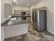 Kitchen with stainless steel appliances and dark countertops at 2154 Pheasant Glen Rd, Charlotte, NC 28214