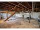 Spacious unfinished basement with a staircase at 2214 Munsen Rd, Concord, NC 28025