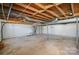 Unfinished basement offering ample storage space at 2214 Munsen Rd, Concord, NC 28025