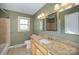 Bathroom boasts granite countertop vanity and tiled shower/tub combo at 2214 Munsen Rd, Concord, NC 28025