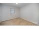 Spacious bedroom with neutral walls and carpeted floors at 2214 Munsen Rd, Concord, NC 28025