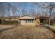 Ranch style home with landscaping and driveway at 2214 Munsen Rd, Concord, NC 28025