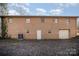 Brick house exterior with a garage and AC unit at 2214 Munsen Rd, Concord, NC 28025