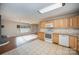 Kitchen with light wood cabinets and granite countertops at 2214 Munsen Rd, Concord, NC 28025