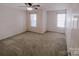 Spacious bedroom featuring carpet flooring and dual windows at 2240 15Th Ne Ave # 105, Hickory, NC 28601