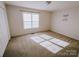 Bright bedroom with window light, carpet, and double door closet at 2240 15Th Ne Ave # 105, Hickory, NC 28601