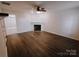 Living room with fireplace and wood-look floors at 2240 15Th Ne Ave # 105, Hickory, NC 28601