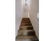 Carpeted staircase leading to the second floor at 2240 15Th Ne Ave # 105, Hickory, NC 28601