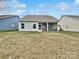 Home with a screened-in porch and grassy backyard at 22433 Gateway Dr, Lancaster, SC 29720