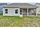 Home exterior with screened porch and lawn at 22433 Gateway Dr, Lancaster, SC 29720