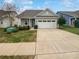 Charming one-story home with light blue siding and a two-car garage at 22433 Gateway Dr, Lancaster, SC 29720