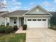 One-story home with a light-blue exterior and a two-car garage at 22433 Gateway Dr, Lancaster, SC 29720