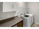 Laundry room with washer, dryer and cabinets at 22433 Gateway Dr, Lancaster, SC 29720