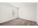 Well-lit bedroom featuring carpet and a window at 2262 Redstone Dr, York, SC 29745