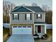 Two-story house with neutral siding, white garage door, and brown accents at 2262 Redstone Dr, York, SC 29745