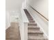 Indoor photo of carpeted staircase with wood handrail at 2262 Redstone Dr, York, SC 29745