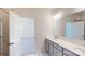 Modern bathroom with double vanity and large mirror at 242 Winford Rd, Troutman, NC 28116