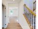 Bright entryway with hardwood floors and staircase at 242 Winford Rd, Troutman, NC 28116