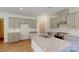 Modern kitchen with gray cabinets and granite countertops at 242 Winford Rd, Troutman, NC 28116