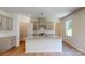 Modern kitchen with gray cabinets, granite island, and white backsplash at 242 Winford Rd, Troutman, NC 28116