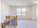 Bright loft area with carpet and two windows at 242 Winford Rd, Troutman, NC 28116