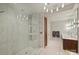 Luxurious bathroom with marble tile, double vanity, and a large shower at 315 Arlington Ave # 2201, Charlotte, NC 28203