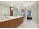 Elegant bathroom featuring a double vanity and marble tile at 315 Arlington Ave # 2201, Charlotte, NC 28203