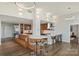 Open concept kitchen with wood cabinetry and breakfast bar at 315 Arlington Ave # 2201, Charlotte, NC 28203