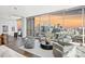 Modern living room boasts stunning city views from floor-to-ceiling windows at 315 Arlington Ave # 2201, Charlotte, NC 28203