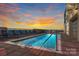 Relaxing rooftop pool with city views and sunset backdrop at 315 Arlington Ave # 2201, Charlotte, NC 28203