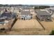 Aerial view of a home showcasing a large fenced backyard and inviting outdoor living spaces and lush surrounding neighborhood at 3332 Delaware Dr, Denver, NC 28037