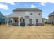 View of backyard with patio, grill, hot tub, and grassy area enclosed by a fence at 3332 Delaware Dr, Denver, NC 28037