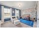 Bedroom with dog wallpaper, gold crib, armchair and bright natural light at 3332 Delaware Dr, Denver, NC 28037