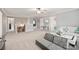 Large bonus room featuring neutral carpet, a sofa, and plenty of natural light at 3332 Delaware Dr, Denver, NC 28037