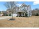 Two-story home with front porch and landscaped yard at 3332 Delaware Dr, Denver, NC 28037