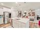 Kitchen area with white cabinets, stainless steel appliances, and a large center island with bar seating at 3332 Delaware Dr, Denver, NC 28037