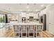 Bright open kitchen features stainless steel appliances, a large island with bar seating, and pendant lighting at 3332 Delaware Dr, Denver, NC 28037