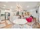 Open concept living space featuring a modern chandelier, stainless appliances, and bright, neutral decor at 3332 Delaware Dr, Denver, NC 28037