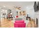 Bright living room with a ceiling fan, modern decor, and hardwood floors is move-in ready at 3332 Delaware Dr, Denver, NC 28037