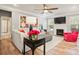 Bright living room featuring a fireplace, modern decor, and wood floors at 3332 Delaware Dr, Denver, NC 28037