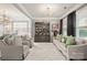 Sophisticated living room featuring a decorative rug, chandelier, and stylish decor at 3332 Delaware Dr, Denver, NC 28037