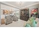 Cozy living room showcases modern decor, stylish seating, and a large cabinet for display, adjacent to the dining area at 3332 Delaware Dr, Denver, NC 28037