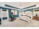 Main bedroom with tray ceiling, ceiling fan, workout bike and natural light at 3332 Delaware Dr, Denver, NC 28037