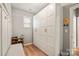 Functional mudroom with built-in storage cabinets, a bench, and a shoe rack at 3332 Delaware Dr, Denver, NC 28037