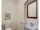 Small bathroom with pedestal sink, toilet and antique mirror at 3821 Silver Bell Dr, Charlotte, NC 28211