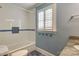 Clean bathroom with shower/tub combo, white tile, and blue accents at 3821 Silver Bell Dr, Charlotte, NC 28211