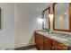 Bathroom with double vanity, granite countertop, and large mirror at 3821 Silver Bell Dr, Charlotte, NC 28211