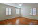 Bright bedroom with hardwood floors and plantation shutters at 3821 Silver Bell Dr, Charlotte, NC 28211