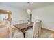 Elegant dining room with hardwood floors, chandelier, and view into another room at 3821 Silver Bell Dr, Charlotte, NC 28211